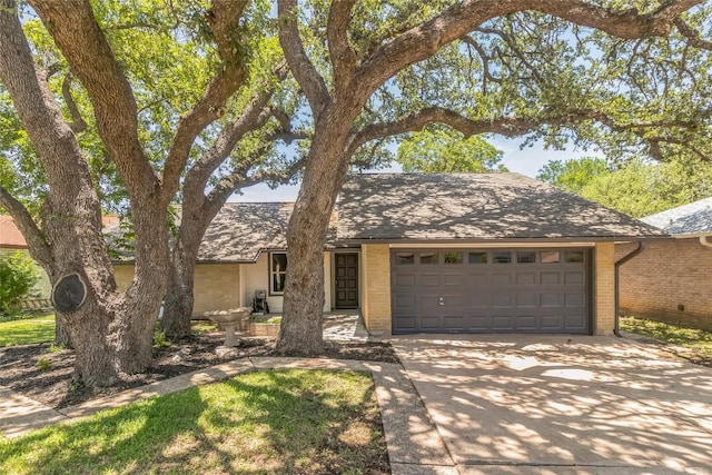 10108 Osprey Ct, Austin, TX 78750 - view of front facade with concrete driveway, a garage, and brick siding