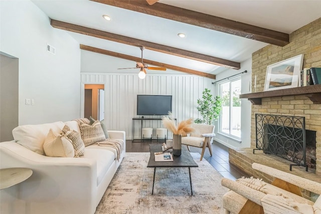 10108 Osprey Ct, Austin, TX 78750 - living room with wood finished floors, a ceiling fan, and a fireplace
