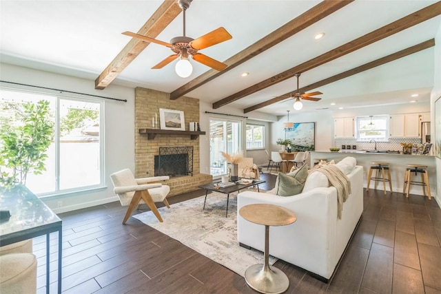 10108 Osprey Ct, Austin, TX 78750 - living area featuring a ceiling fan, dark wood finished floors, a fireplace, and recessed lighting