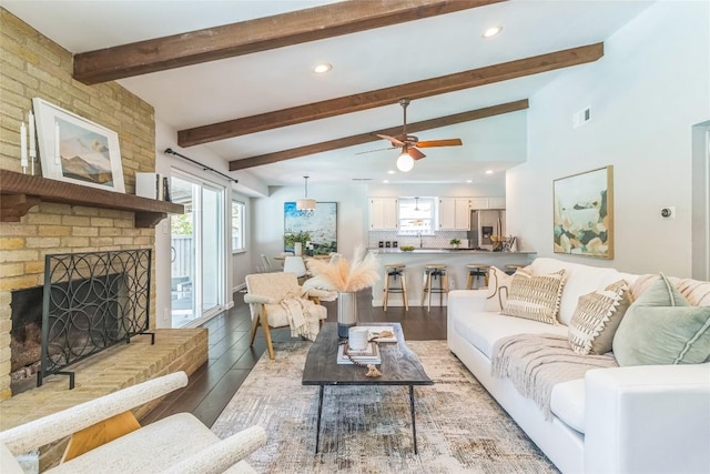 10108 Osprey Ct, Austin, TX 78750 - living room with a ceiling fan, healthy amount of natural light, wood finished floors, recessed lighting, and a brick fireplace
