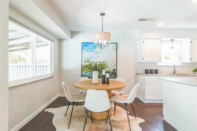 10108 Osprey Ct, Austin, TX 78750 - dining room with dark wood-style flooring, baseboards, and recessed lighting