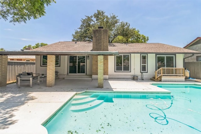 10108 Osprey Ct, Austin, TX 78750 - rear view of house featuring a chimney and a patio
