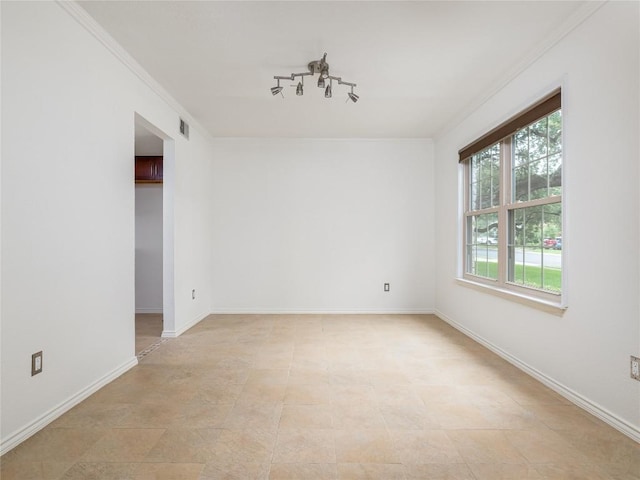 12208 Antoinette Pl, Austin, TX 78727 - spare room featuring crown molding and baseboards