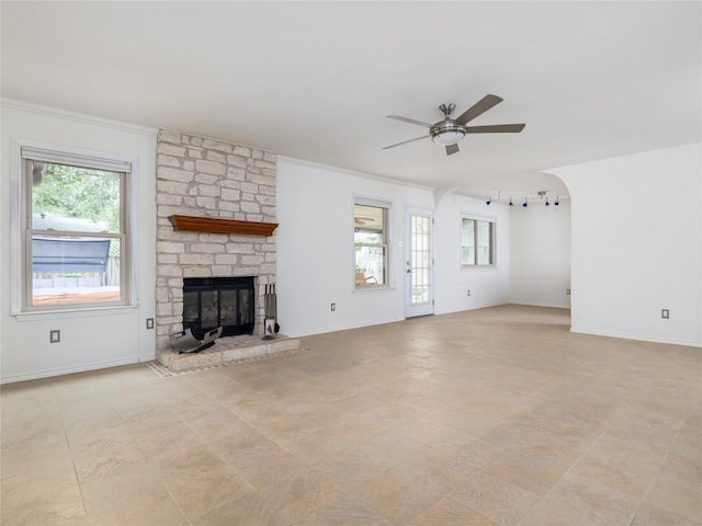 12208 Antoinette Pl, Austin, TX 78727 - unfurnished living room with a ceiling fan, a fireplace, ornamental molding, baseboards, and light tile patterned flooring