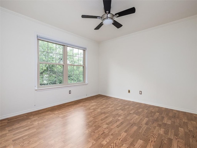 12208 Antoinette Pl, Austin, TX 78727 - unfurnished room featuring wood finished floors, ornamental molding, a ceiling fan, and baseboards