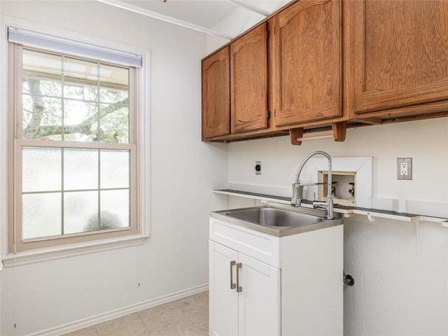 12208 Antoinette Pl, Austin, TX 78727 - kitchen with a sink, brown cabinets, and baseboards