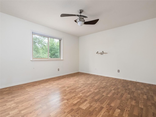 12208 Antoinette Pl, Austin, TX 78727 - unfurnished room featuring wood finished floors, a ceiling fan, and baseboards
