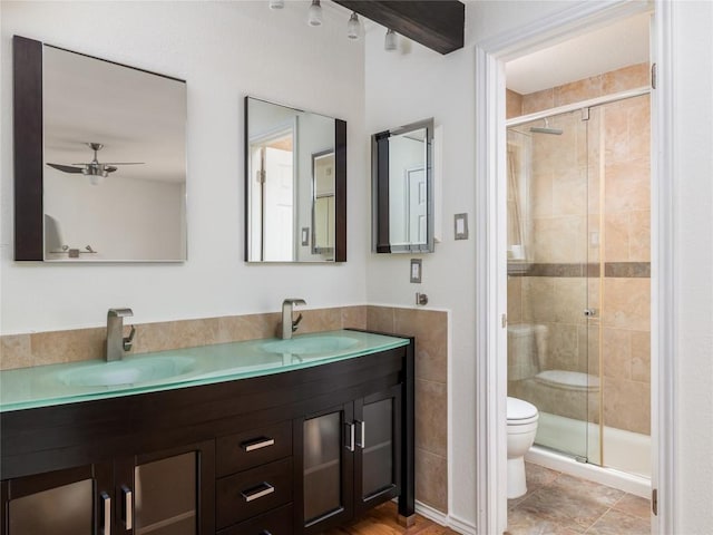 12208 Antoinette Pl, Austin, TX 78727 - full bathroom with a shower stall, double vanity, and ceiling fan