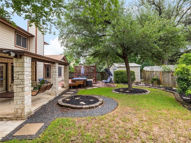 12208 Antoinette Pl, Austin, TX 78727 - fenced backyard featuring a shed, a patio, and an outdoor fire pit