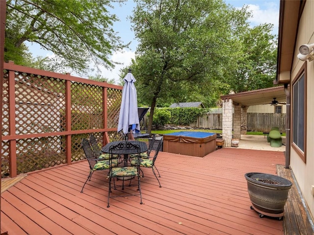 12208 Antoinette Pl, Austin, TX 78727 - wooden terrace featuring a covered hot tub, a fenced backyard, and outdoor dining area
