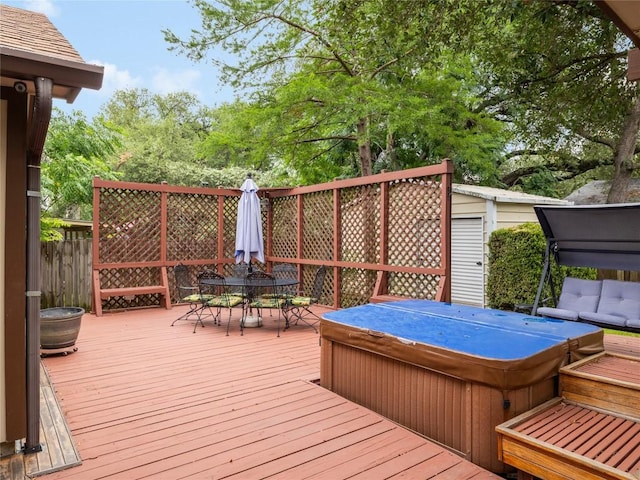 12208 Antoinette Pl, Austin, TX 78727 - wooden deck with a covered hot tub and outdoor dining space