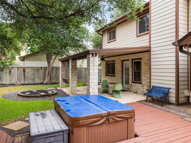 12208 Antoinette Pl, Austin, TX 78727 - wooden deck with a hot tub, an outdoor fire pit, ceiling fan, and a patio