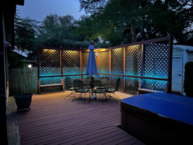 12208 Antoinette Pl, Austin, TX 78727 - deck featuring outdoor dining space and a hot tub