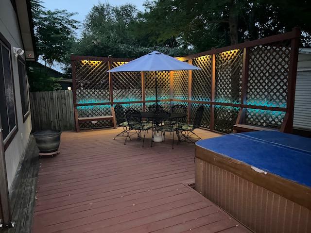12208 Antoinette Pl, Austin, TX 78727 - wooden terrace with outdoor dining space