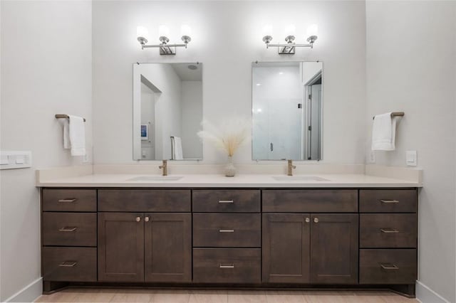 4702 Unity Cir, Austin, TX 78731 - bathroom featuring double vanity and baseboards