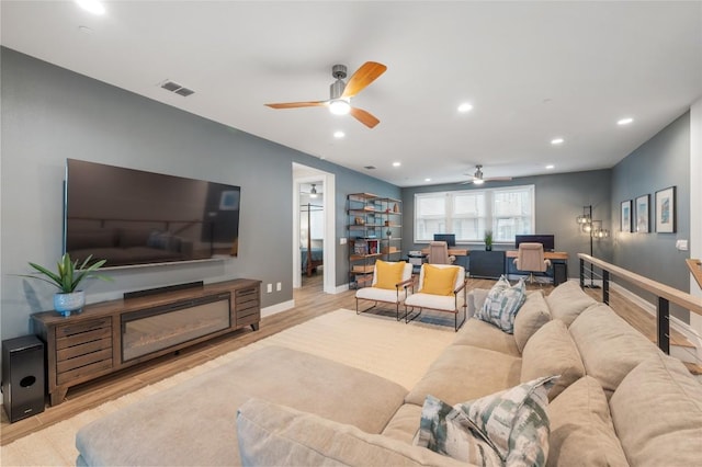 4702 Unity Cir, Austin, TX 78731 - living area with ceiling fan, wood finished floors, recessed lighting, baseboards, and an office area