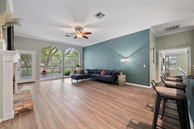 8007 Weldon Springs Ct, Austin, TX 78726 - living room featuring a ceiling fan, crown molding, and wood finished floors