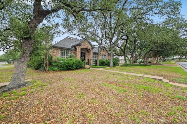 8007 Weldon Springs Ct, Austin, TX 78726 - traditional-style house with brick siding and a front lawn