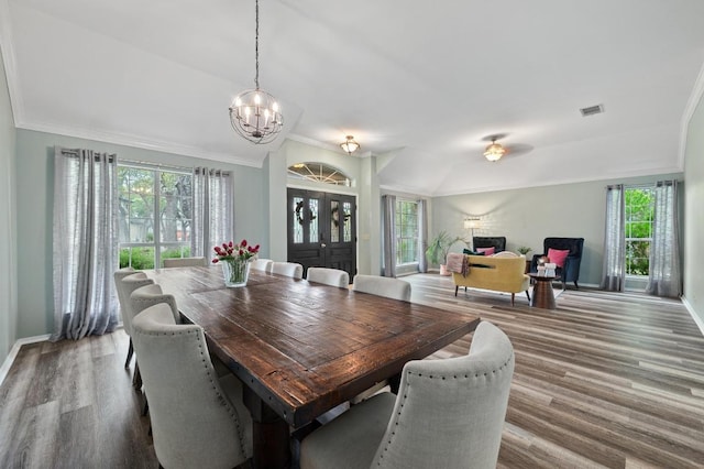 8007 Weldon Springs Ct, Austin, TX 78726 - dining room with a chandelier, wood finished floors, and ornamental molding