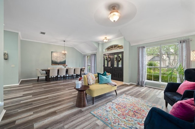 8007 Weldon Springs Ct, Austin, TX 78726 - living area featuring wood finished floors, a chandelier, crown molding, and lofted ceiling