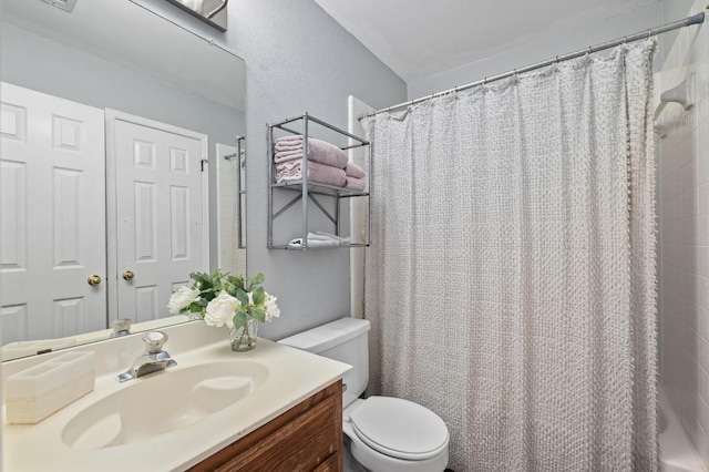 8007 Weldon Springs Ct, Austin, TX 78726 - full bathroom featuring vanity, a shower with curtain, and a textured wall