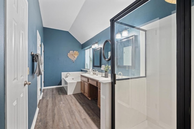 8007 Weldon Springs Ct, Austin, TX 78726 - full bath with a garden tub, vanity, wood finished floors, vaulted ceiling, and walk in shower