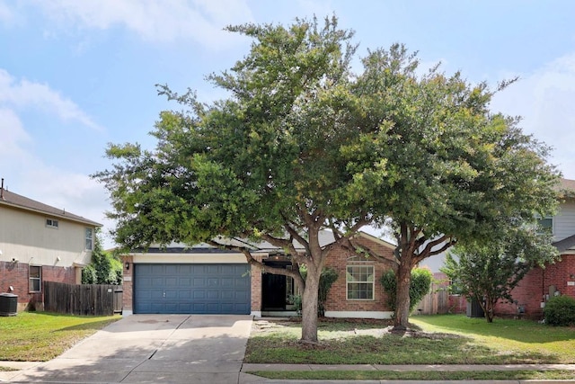 1112 Battenburg Trl, Pflugerville, TX 78660 - view of front facade featuring driveway, brick siding, central AC, and a garage