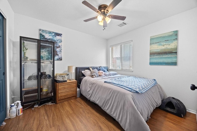 1112 Battenburg Trl, Pflugerville, TX 78660 - bedroom with wood finished floors and ceiling fan