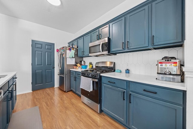1112 Battenburg Trl, Pflugerville, TX 78660 - kitchen featuring stainless steel appliances and blue cabinets
