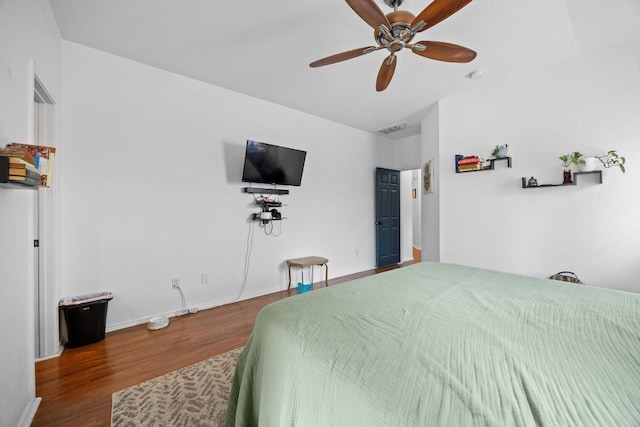 1112 Battenburg Trl, Pflugerville, TX 78660 - bedroom featuring wood finished floors, baseboards, and ceiling fan
