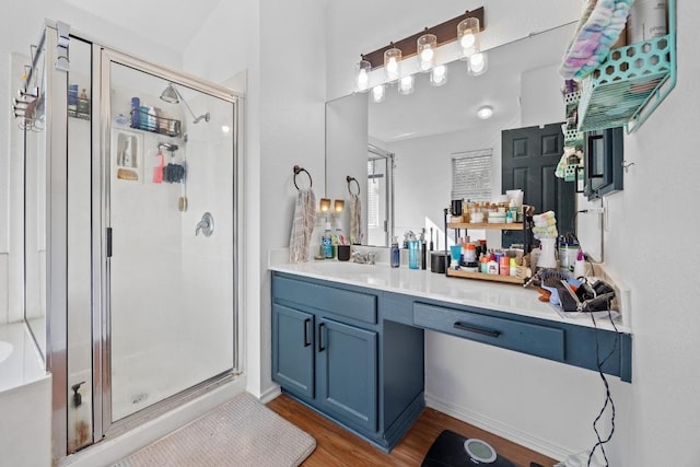 1112 Battenburg Trl, Pflugerville, TX 78660 - full bath featuring a shower stall, vanity, and wood finished floors