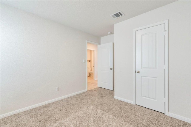 185 Standing Rock Ln, Marble Falls, TX 78654 - unfurnished bedroom with light carpet and baseboards