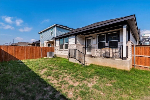185 Standing Rock Ln, Marble Falls, TX 78654 - back of house with central AC and a porch