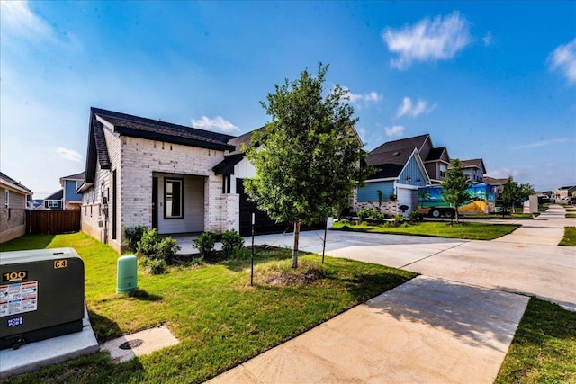 185 Standing Rock Ln, Marble Falls, TX 78654 - view of front of property featuring concrete driveway, brick siding, a residential view, and board and batten siding