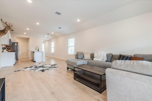 185 Standing Rock Ln, Marble Falls, TX 78654 - living room with light wood-type flooring, recessed lighting, and baseboards