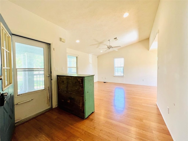 2105 W Gillis Ave, Cameron, TX 76520 - kitchen with light wood finished floors, plenty of natural light, a ceiling fan, and recessed lighting
