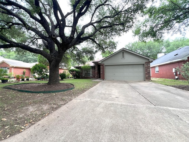 6612 Zequiel Dr, Austin, TX 78744 - view of front of property with driveway, brick siding, an attached garage, and a front yard