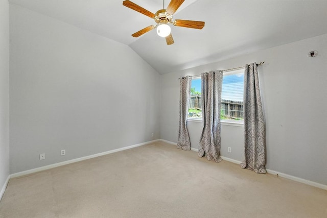 5000 Acorn Grove Ct, Austin, TX 78744 - unfurnished room featuring light carpet, vaulted ceiling, baseboards, and a ceiling fan