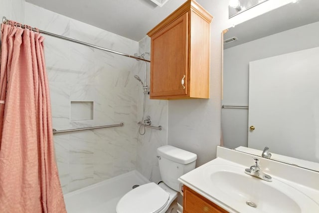 5000 Acorn Grove Ct, Austin, TX 78744 - full bathroom with vanity, a marble finish shower, and toilet