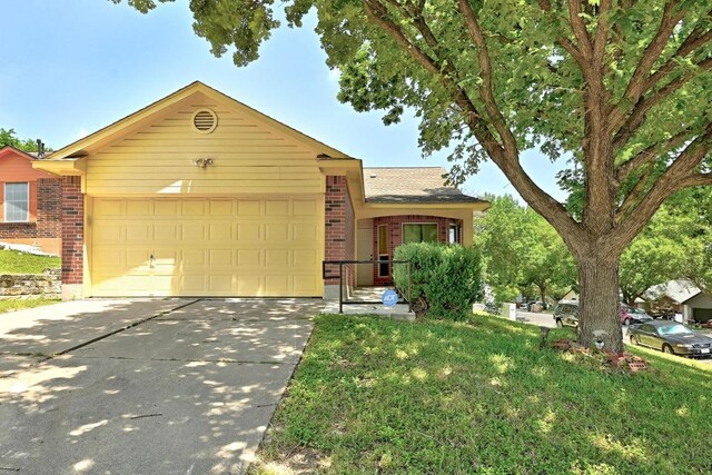5000 Acorn Grove Ct, Austin, TX 78744 - ranch-style home featuring brick siding, concrete driveway, a garage, and a front yard