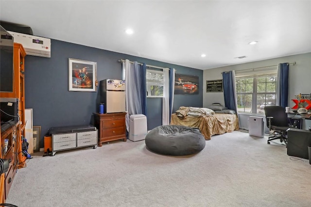 1313 Oakridge Dr, Blanco, TX 78606 - carpeted bedroom featuring freestanding refrigerator, an office area, recessed lighting, and a wall mounted AC