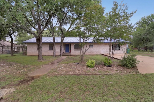 1313 Oakridge Dr, Blanco, TX 78606 - view of front of home with metal roof and a standing seam roof