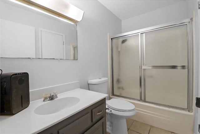 1313 Oakridge Dr, Blanco, TX 78606 - full bath featuring vanity, toilet, bath / shower combo with glass door, and tile patterned floors