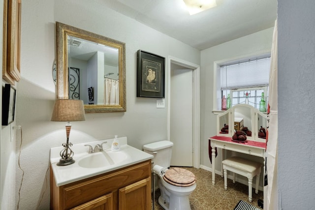3780 Fm 972, Georgetown, TX 78673 - full bathroom with vanity, toilet, and baseboards