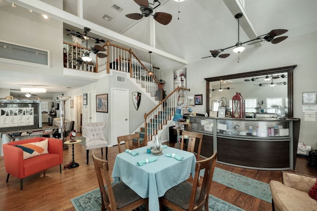 3780 Fm 972, Georgetown, TX 78673 - dining room featuring a ceiling fan, high vaulted ceiling, wood finished floors, stairway, and beamed ceiling