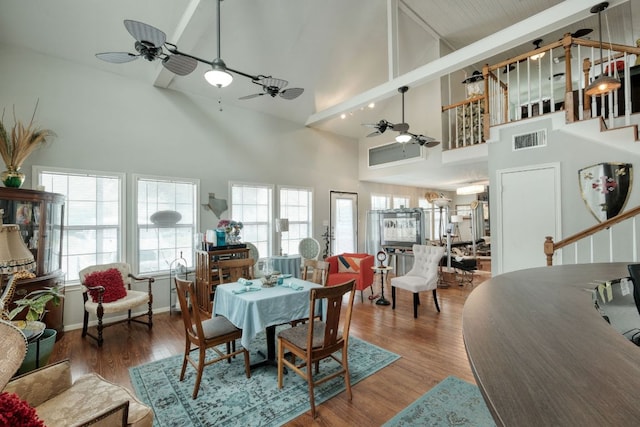 3780 Fm 972, Georgetown, TX 78673 - dining room with a ceiling fan, high vaulted ceiling, wood finished floors, and stairs