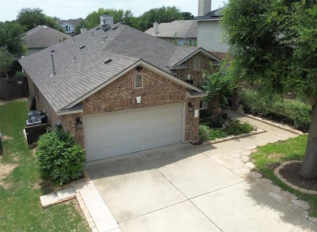 2721 Saddle Blanket Pl, Leander, TX 78641 - view of front of property featuring brick siding, a shingled roof, an attached garage, and driveway