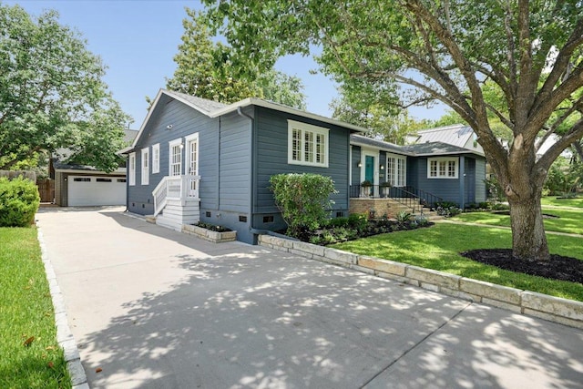 2509 Spring Ln, Austin, TX 78703 - view of front of home with an outdoor structure, a garage, and a front lawn