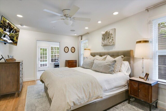 2509 Spring Ln, Austin, TX 78703 - bedroom featuring light wood-type flooring, multiple windows, recessed lighting, baseboards, and a ceiling fan