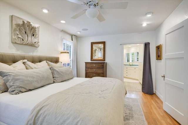 2509 Spring Ln, Austin, TX 78703 - bedroom featuring light wood-style floors, multiple windows, recessed lighting, ensuite bath, and ceiling fan